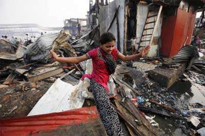 Name:  Rubina Ali of 'Slumdog Millionaire' fame jumps as she inspects the ruins of the shanty .jpg
Views: 2205
Size:  22.3 KB