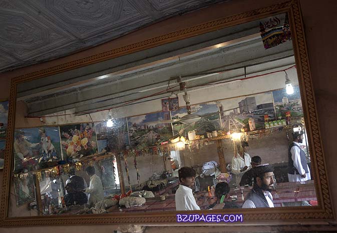Name:  Afghan men are reflected in a mirror hanging in a barber shop located near an Afghan refugee vil.jpg
Views: 816
Size:  75.5 KB