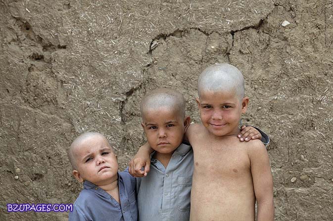 Name:  Siblings of Afghan descent pose for a picture against the mud walls of their home in a refugee v.jpg
Views: 537
Size:  87.2 KB