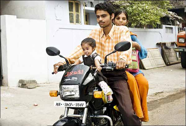 Name:  Jyoti is taken to school on brother Satish's motorbike, along with sister Archana.jpg
Views: 861
Size:  54.9 KB