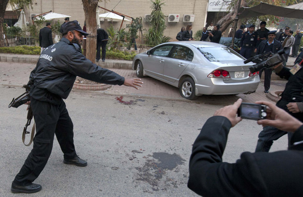 Name:  A policeman signals to the media to keep away from the site where Governor of Punjab Salman Tase.JPG
Views: 2094
Size:  106.6 KB