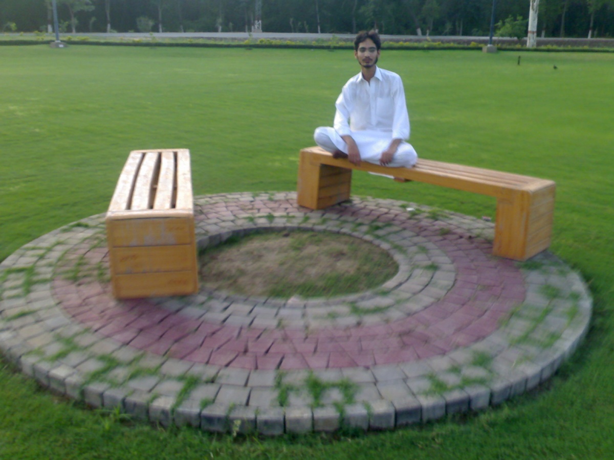 Me at Bench in ground at University