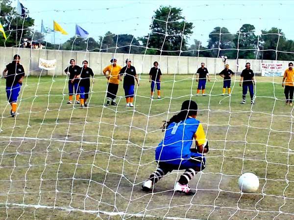 Players of Lahore Fighter Club and Sports Science Club teams struggling to get hold on the ball during Inter Club Women Championship played at Punjab University Ground