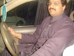 Sir Ahmad Tisman Driving the Car